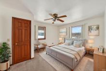 Main-floor primary bedroom - virtually staged