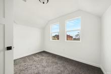 primary suite with half bath and views of DTSB