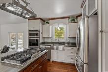Stainless appliances including new cooktop and faucet